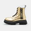 * | Moschino Combat Boots Maxi Logo Print Lace-Up Ankle Boots Gold