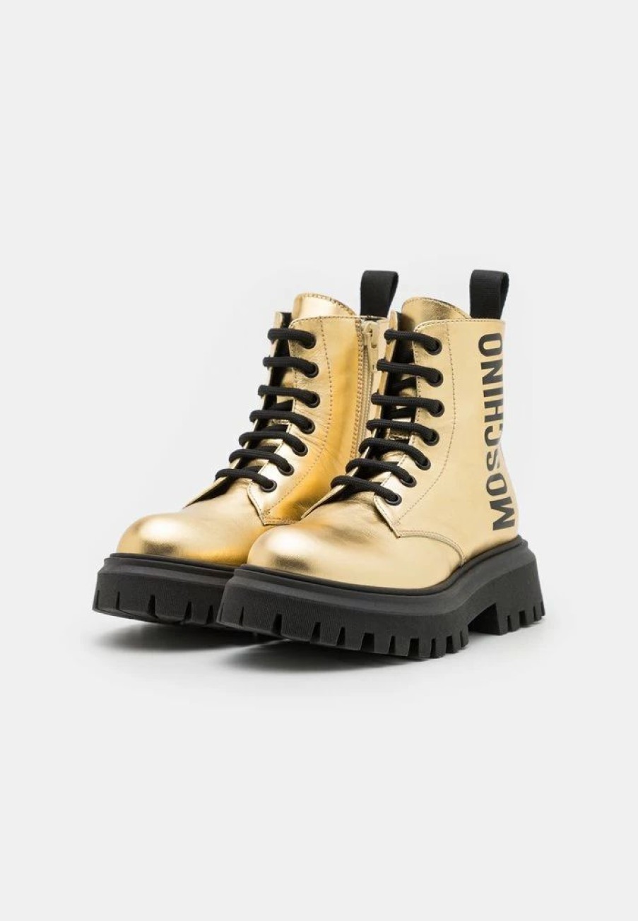 * | Moschino Combat Boots Maxi Logo Print Lace-Up Ankle Boots Gold